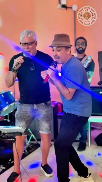 Real photo of the singer and live band, with stage lights, at La Divina Commedia Coronado