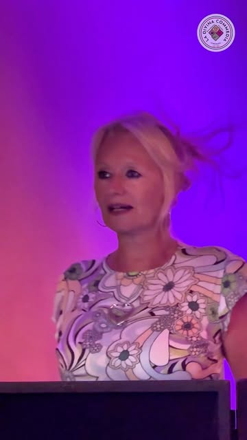 Real photo of a guest singing live under purple lights at La Divina Commedia Coronado